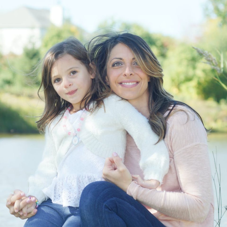 Andy Hill's wife with their daughter