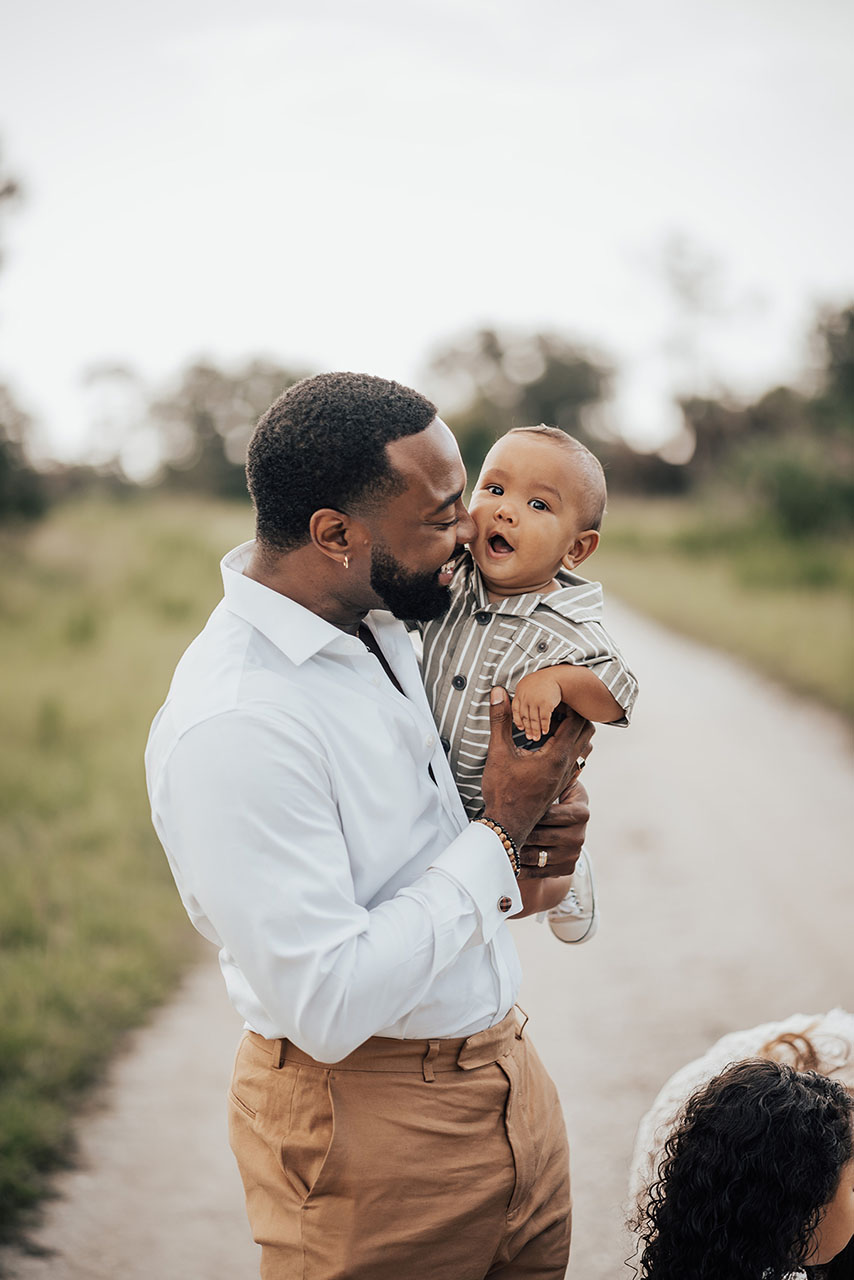 Dana Harvey holding his son