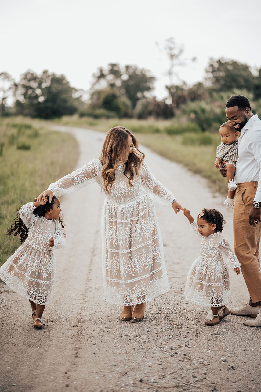 Dana Harvey and family outside on dirt road