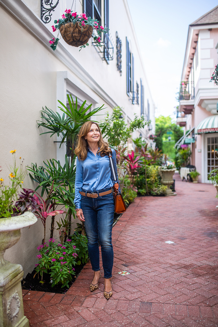 Nancy Weiss walking on the streets of beach town.