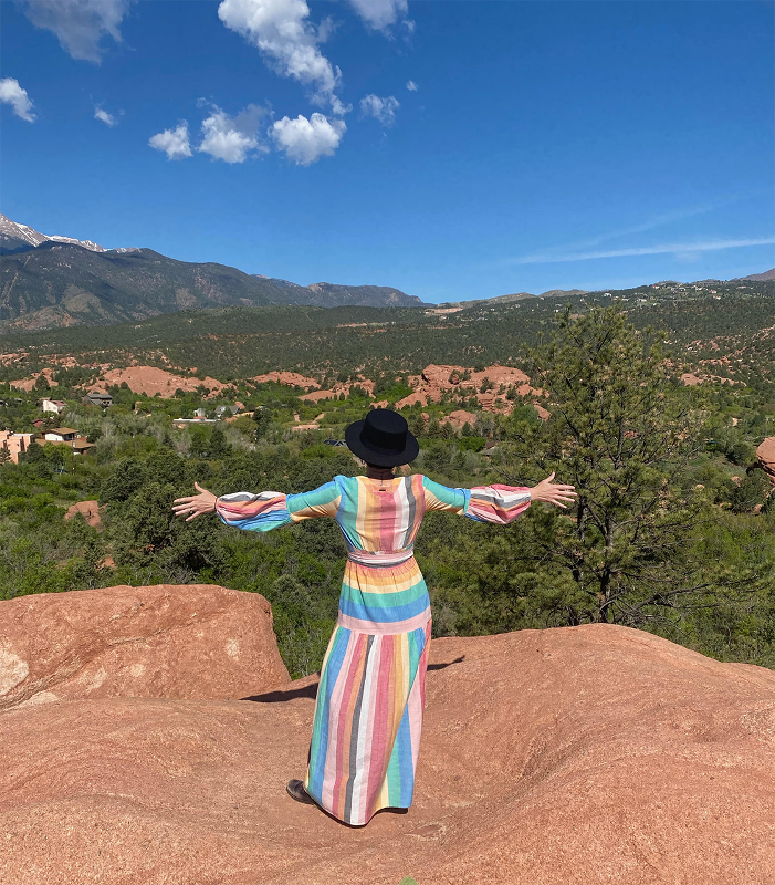 Woman enjoying the view from a mountain plateau